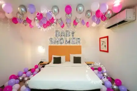 Mom to be chair balloon decoration setup at home, Gurugram