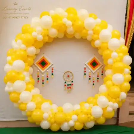Haldi ceremony traditional yellow floral and balloon backdrop, Gurugram