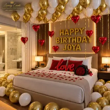 Gold and red romantic birthday hotel room decoration in DLF Phase 3 Gurugram by Luxury Events