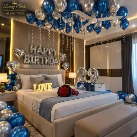 Royal blue and silver birthday hotel room decoration with LED numbers in DLF Phase 4 Gurugram by Luxury Events