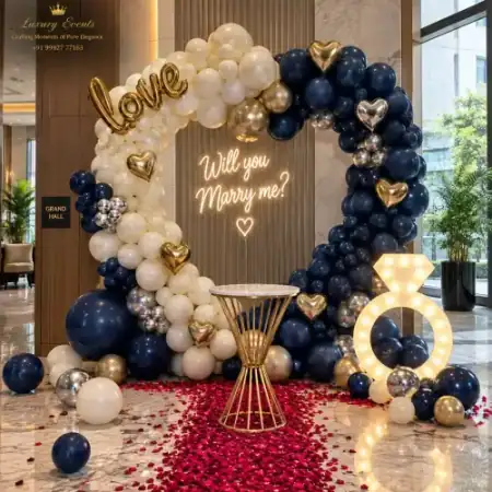 Marry Me setup in DLF Phase 5 Gurugram with royal blue and gold balloon ring arch and marquee diamond ring