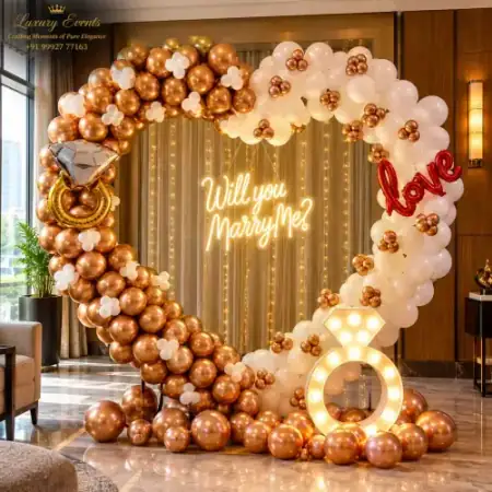 Marry Me setup in Sector 9A Gurugram with gold and white heart balloon arch, glowing neon sign and fairy lights