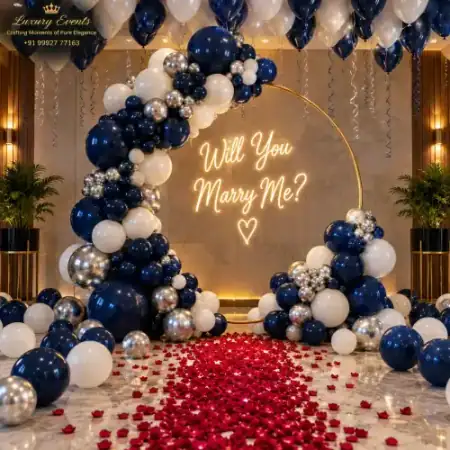 Marry Me setup in Sohna Road Gurugram with royal navy blue and silver balloon ring arch and neon sign