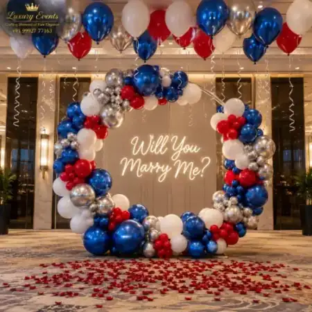Royal blue, silver, and red circular ring arch proposal decoration with warm Will You Marry Me LED neon sign in DLF Phase 4 Gurugram