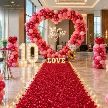 Proposal decoration in Golf Course Road Gurugram with red heart balloon arch and rose carpet