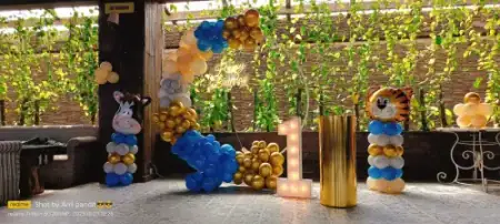 Minion theme birthday decoration with grass wall backdrop, Gurugram
